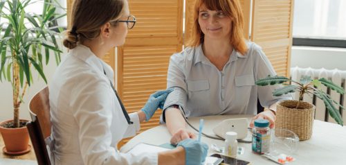 Doctor checking a patient's blood pressure